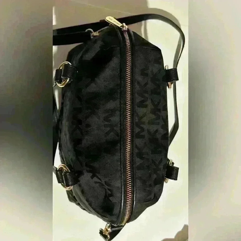 A Mickael Kors black Gladstone satchel with gold tone hardware. - Picture 7 of 14